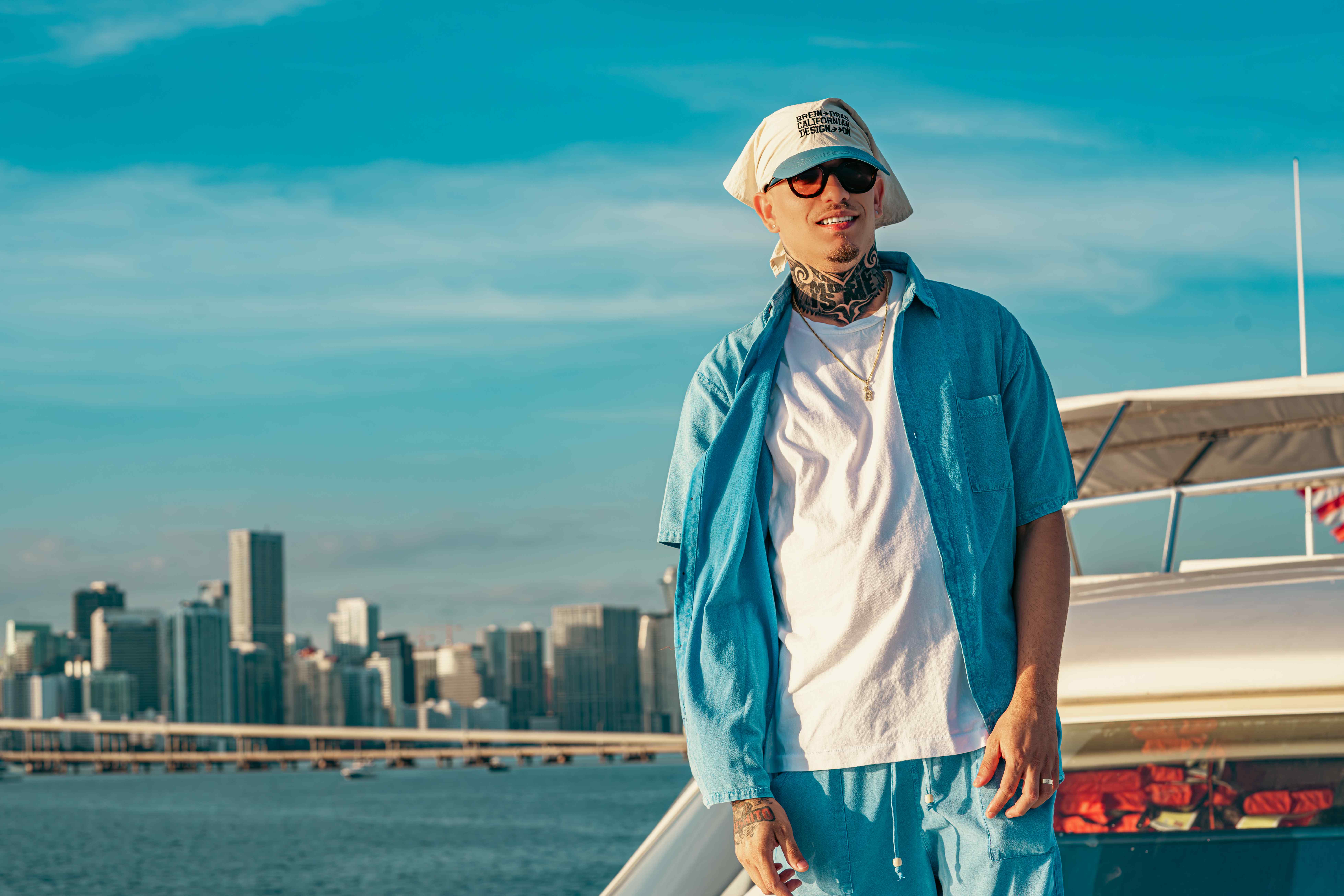 Bebeshito on yacht with Miami skyline